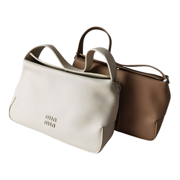 Dos carteras ZEFORA estructuradas de cuero sintético en colores blanco y beige con asas cortas y diseño minimalista.