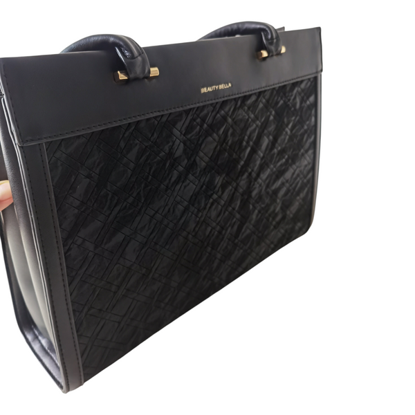 Cartera ZEFORA Firenze negra de gran tamaño con textura geométrica en relieve, asas largas y detalles metálicos.