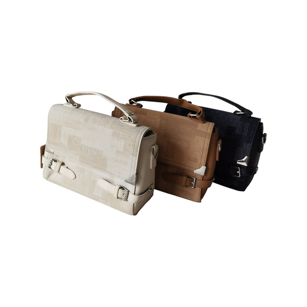 Cartera Roma ZEFORA en colores beige, camel y negro con diseño estructurado, solapa frontal y detalles metálicos.
