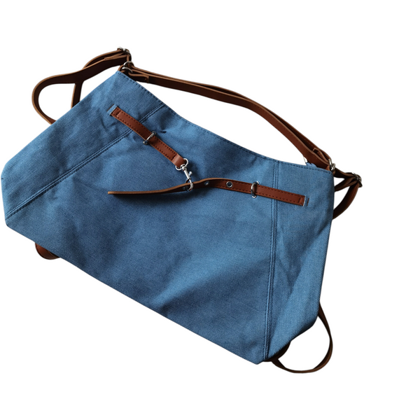 Cartera grande ZEFORA color azul con correas decorativas marrones y asa de hombro, estilo casual y moderno.