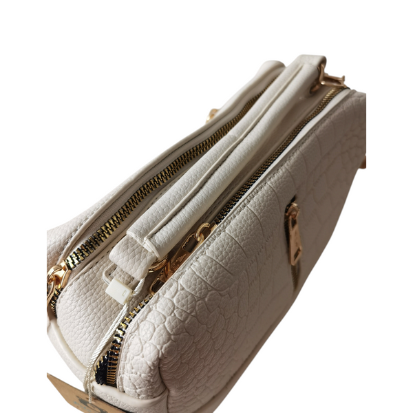 Cartera ZEFORA Camila color crema con textura tipo piel, diseño estructurado, cremalleras doradas y asas superiores